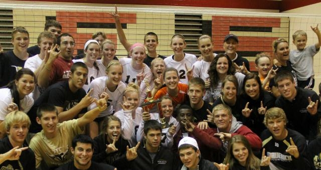 South volleyball team celebrates with fans after winning first at the Maize tournament on Sept. 17. The team beat six teams from 5A and 6A schools to take first. Photo courtesy of Patty Sterneker