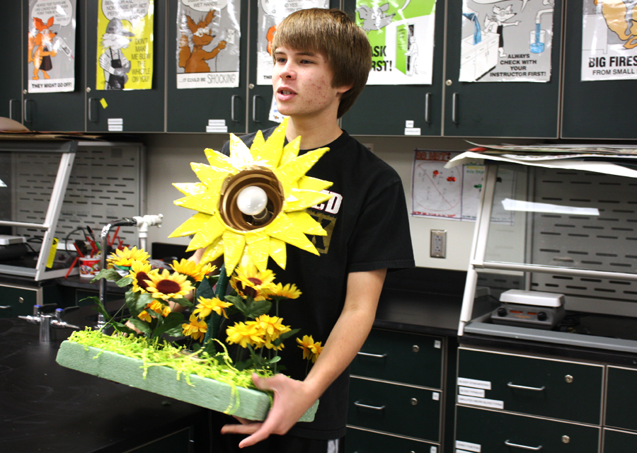 Dalton Glasscock, 11, presents his dicot flower in Robbye Herrington's  Advanced Placement Biology class. Glasscock spent two hours preparing the project. Phot by C. Kasitz