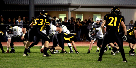 Cody Weston, 12, Drake Dukes, 12, Joe Hobert, 12, And Nate Johnson, 12, get ready for a play. South lost the game against Andale 48-6. Photo by J. Funschelle