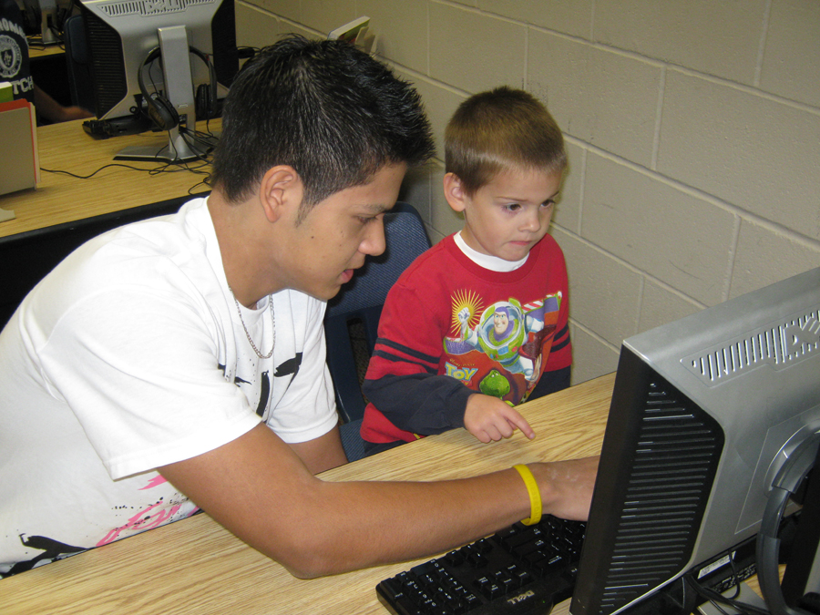Zak Hassouneh, 11, works with an ECC student to create a silly story. The class planned to work again wtih the ECC students. Photo by LeAnne Bryant