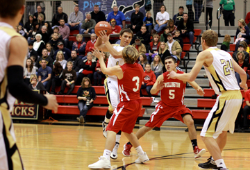 Wes Phillips, 11, gets guarded by Wellington players and has no other choice but to pass the ball. Wellington defeated South, 39-54 Photo by E. Steenbock