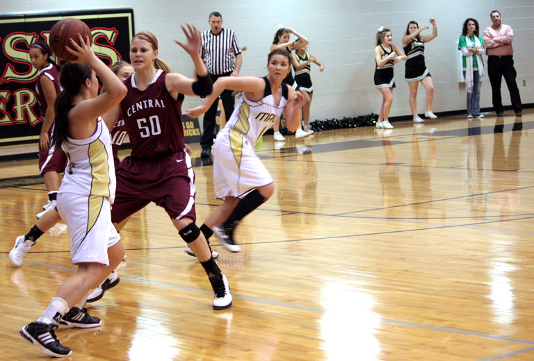 Jessica Domnick, 12, wards off a Salina Central defender, but lost 56-32 on Dec. 6. The Lady Mavs won the first game back Jan. 3 against Circle. Photo by T. Mitchell