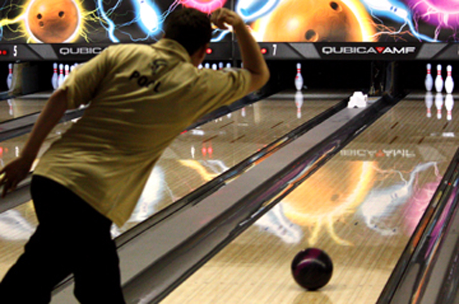 Logan Pool, 11, bowls for his frame at a bowling meet while he tries for a spare. Boys’ and girls’ varsity bowling placed first on Jan. 20. Photo by T. Mitchell