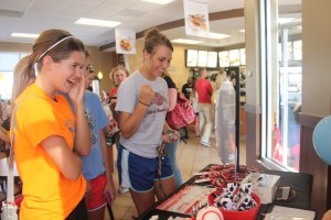Junior Brooke Bugbee spins the prize wheel Tuesday for spirit night held at Chick-fil-A supporting the volleyball team.