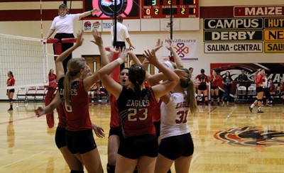 The Lady Eagles celebrate a victorious play Thursday night. Photo by Jet Warren. 