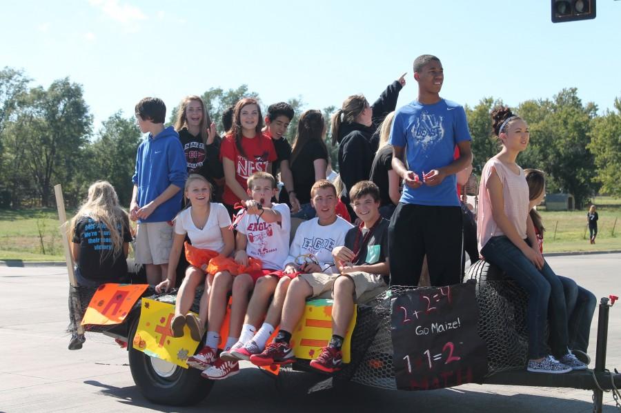 Sophomore Jacob Schultz participates with friends on the math float, Friday.