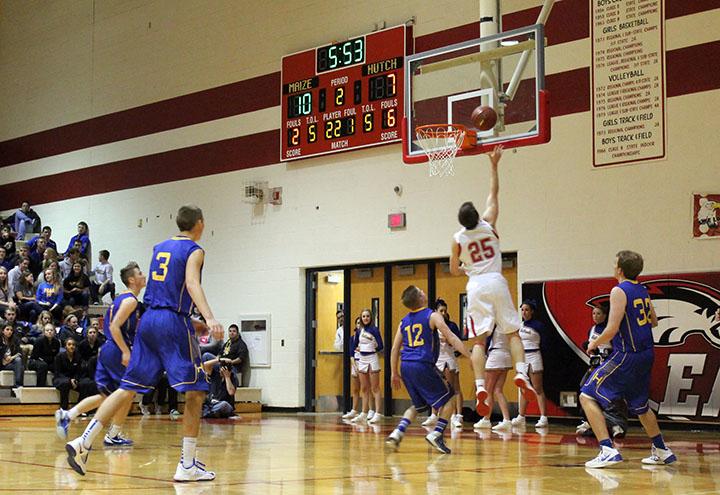 Senior Aaron Shaw goes up for a layup during a home game against Hutch. Photo by Delanie Peirce.