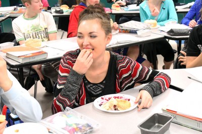 Sophomore Kelsi Arguello eats bread made in Kruse's biology class. Photo by: Meagan Wofford