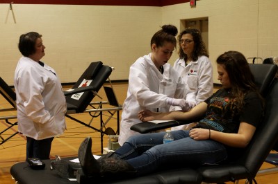 Sophomore Tyanna Fitzmier gives blood at the Maize blood drive.  
