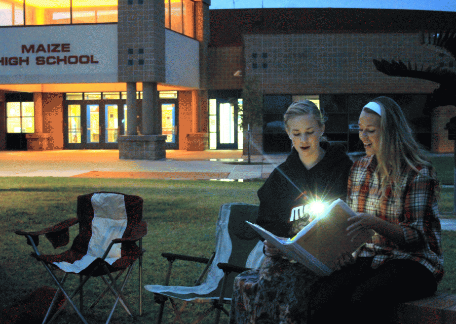 Junior Madison Fitzmier and Sophomore Katie Krier lead worship at See You at The Pole this morning.