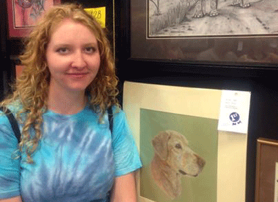 Senior Chole Cloud stands with one of her first place winnings at the Kansas State Fair.