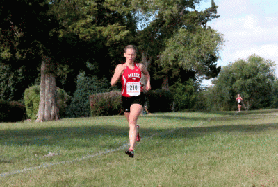 Senior Deidra Walker finishes her race in at the Emporia Invitational.  Walker took first in the race. 