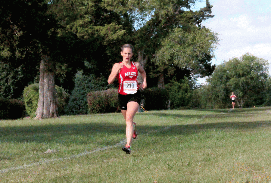 Senior Deidra Walker finishes first in her race at the Emporia Invitational.