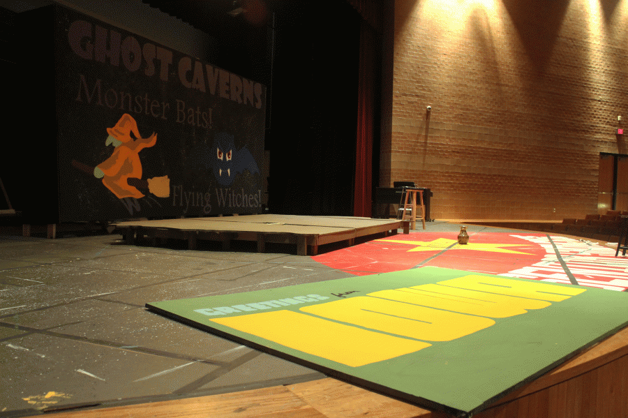 The drama department prepares for the production of Iowa by painting the sets.