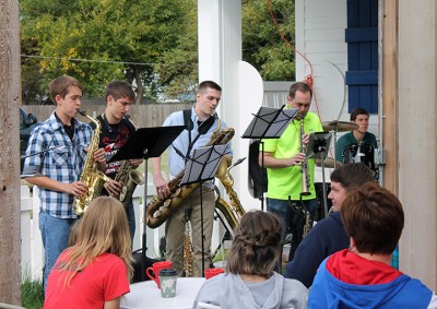 Stand Benders Sax Quintet plays on Moxi Junction's patio after the Maize Fall Festival Parade.