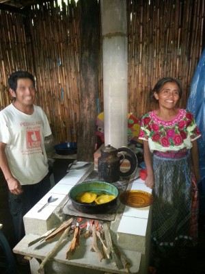Guatemalans next to a stove similar to the ones KAY club will be buying with the World Market fundraiser donations.