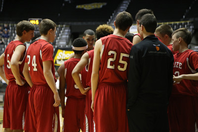 The team huddles up for a play against Wichita East Wednesday March 11. Photo by Cheyenne Esser.