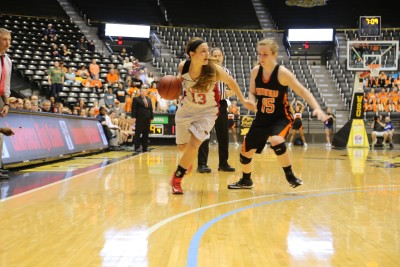 Junior HaLee Roland dribbles the ball up the court during Friday's game.