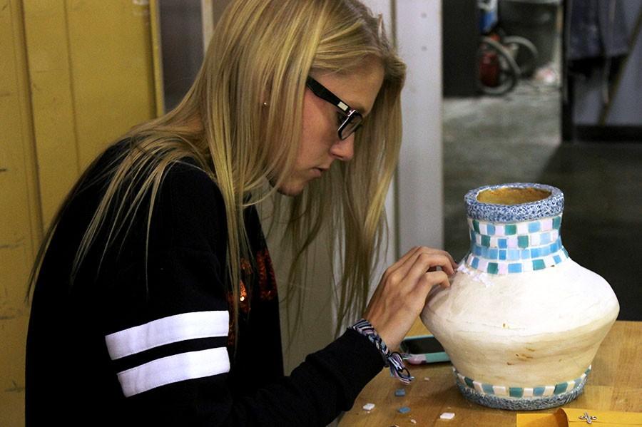 Junior Aspen Pope works on her Ceramics 1 project in Mrs. Coxs class.