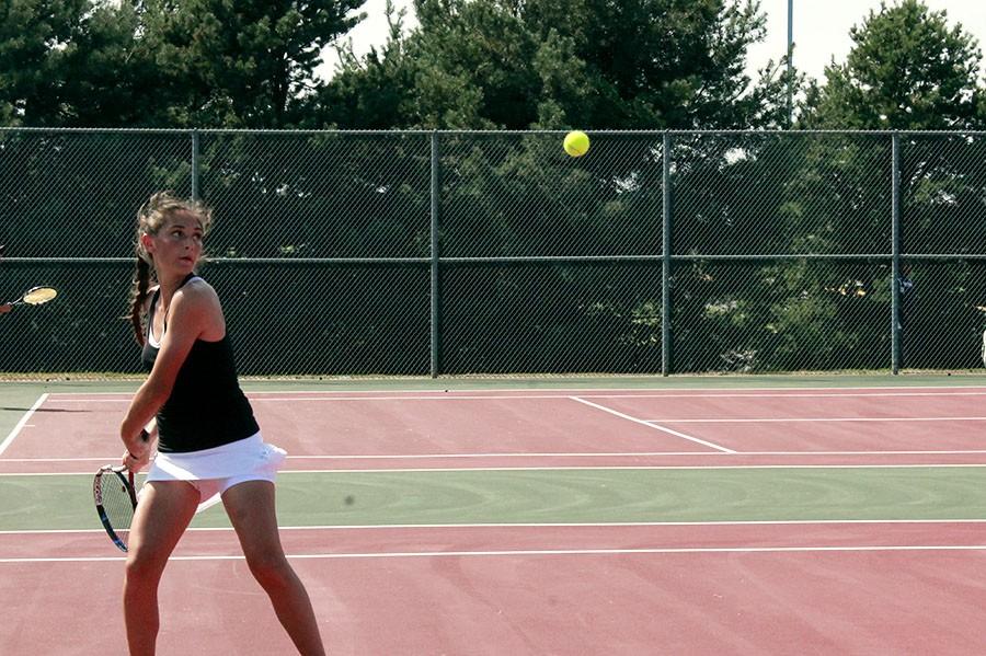 Senior Tiffani Holman returns the ball during a match. Holman will be competing at regionals this Saturday at Valley Center.