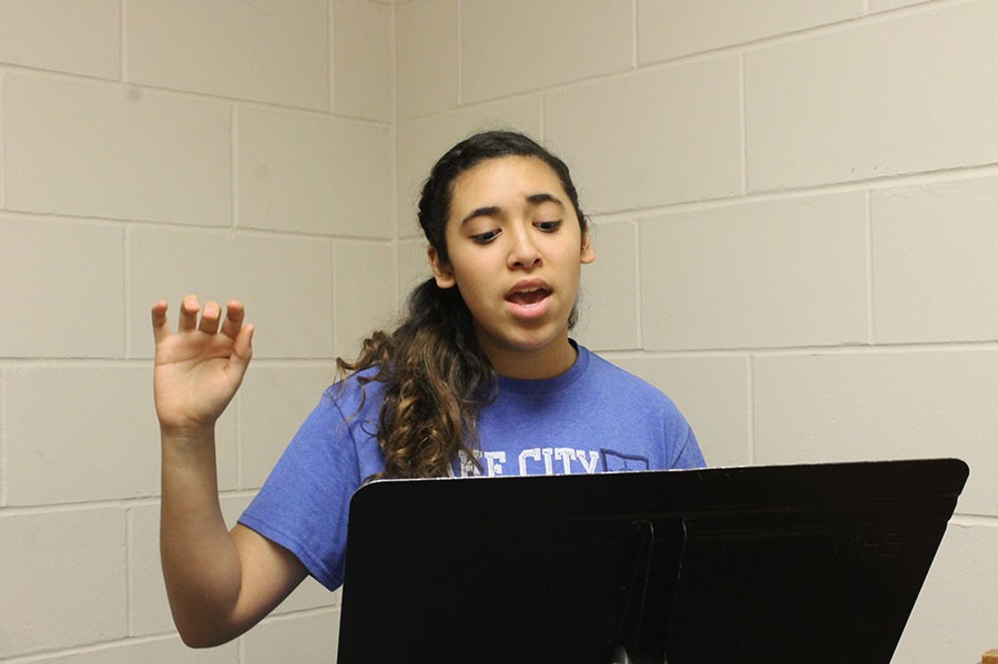 Sophomore Alanis Balza practices the song Forever Music for an upcoming choir concert. The concert will be held at St. Elizabeth Sunday at 3:00 p.m. 