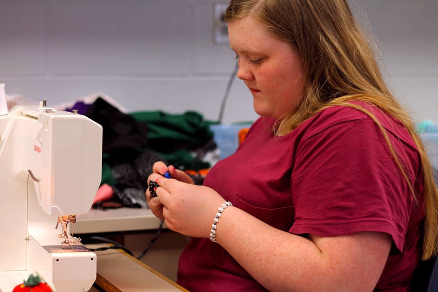 Emily Casteel works on a project in sewing I