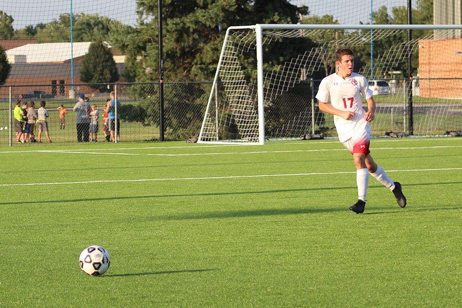 Sophomore Nick Reiswig kicks the ball up field. Soccer lost to Derby 2-1 Tuesday.
