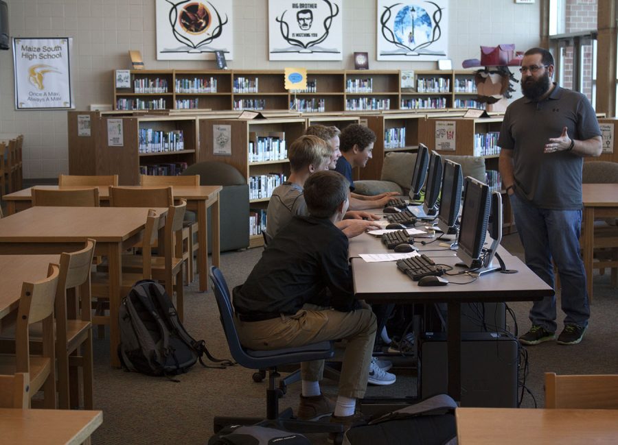 Jed Heath, science, explains the assignment to his students. "I would rather get my assignments done in class than stress after school." Jack Manske, 9, said. Photo by K. Angle