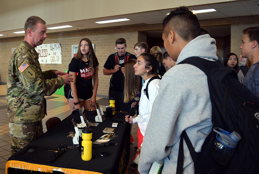 Army Recruitment Officer speaks with South students during MavTime. He spoke with them about the benefits of joining the Army. Photo by S. Epke