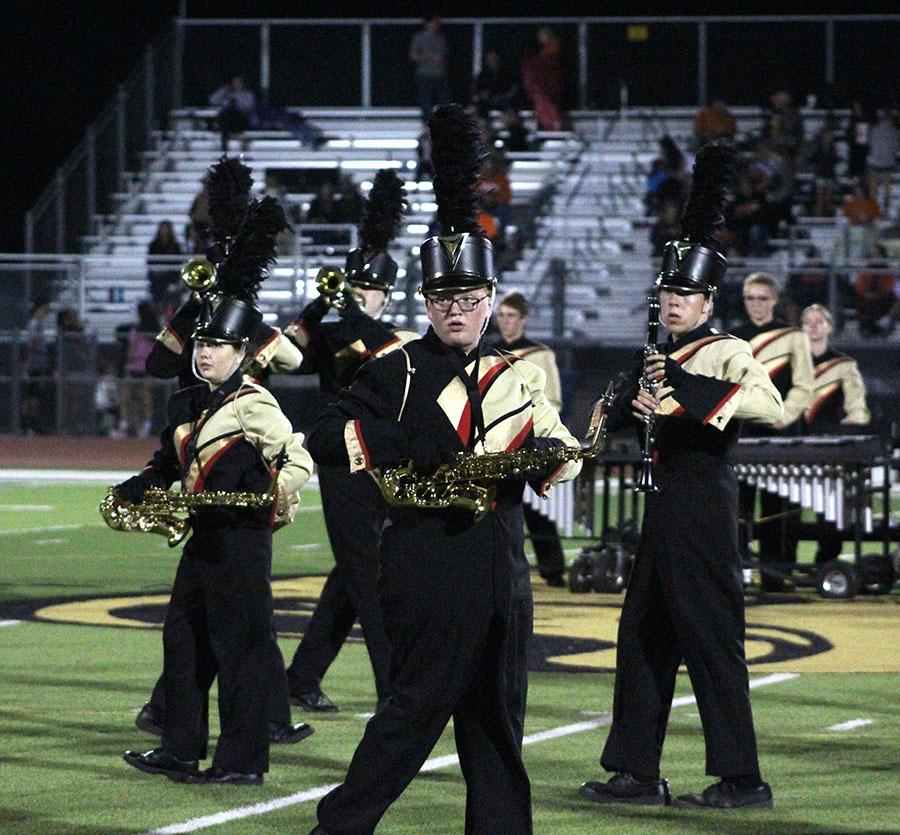 Marching Band performing during half time during the Senior Night football game. The senior band members were recongized along with football, cross country, tennis and more. Photo by T. Pokorski