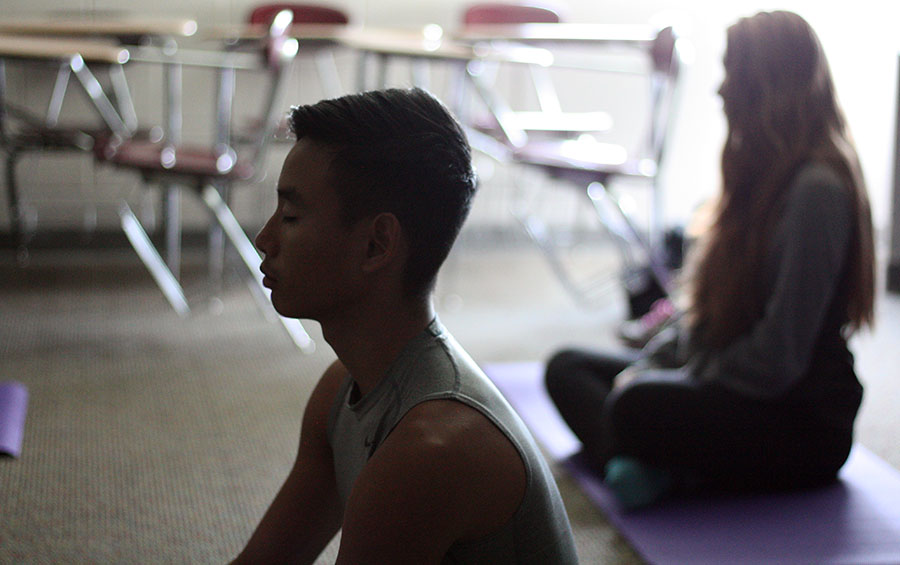 Nikkolas Vichith, 11, practices yoga during MavTime. Students meet every Monday for Mindfulness Monday. Photo by C. Traudt