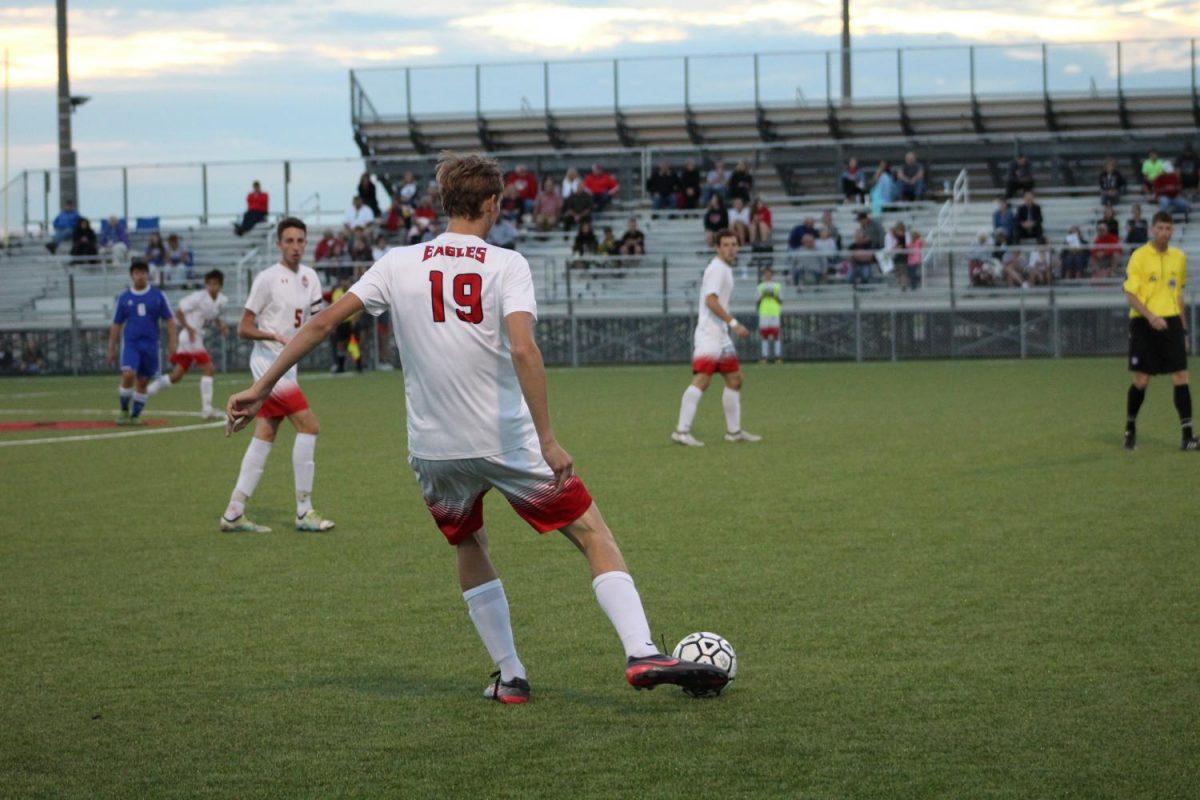 Senior Ethan Kingrey passes the ball out of pressure. Maize fell to Salina Central 2-1 and defeated Goddard 7-0. 