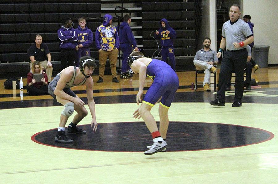Jason West, 12, takes his stance during his first match of his senior year wrestling season. West won his match while South as a whole fell short to Ark City. Photo by O. Blanford