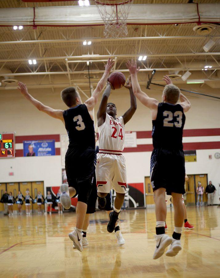 Senior JayJay Johnson shoots for a two. Maize was defeated 88-66 against Eisenhower.