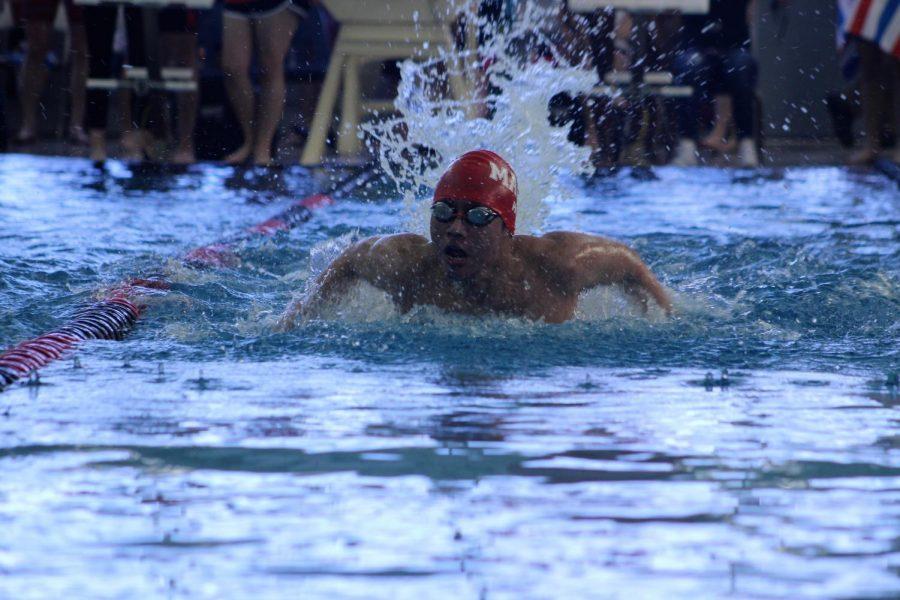 Senior Brandon Ho competes in the 100 yard butterfly. 