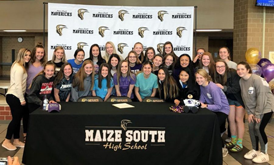 The Lady Mavs soccer team after Madi Edwardss signing. The next signings will be held Mar. 12 for Angela Radar and Mar. 14 for Kiley Angle, both will be attending Hutchinson Community College in the fall. Photo courtesy of Madi Edwards.