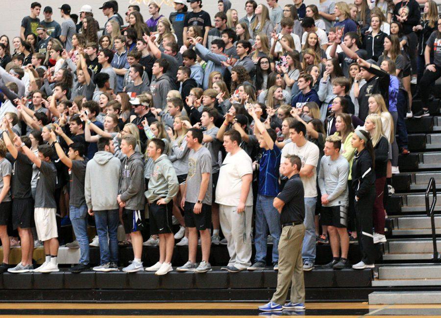 Students watched and supported the Mavericks against Derby. Dave Nash, vice principal, stands while the Mavericks shoot a free throw. Photo by B. Jones-Rupp