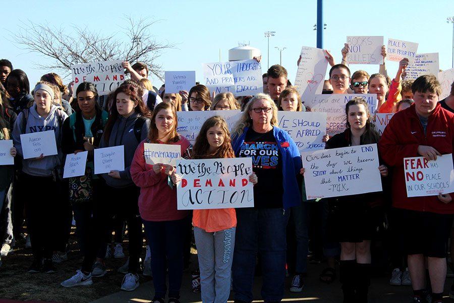 Students held up signs during the walkout from March 14, 2018 in remembrance of the lives lost in the Stoneman-Douglas shooting.