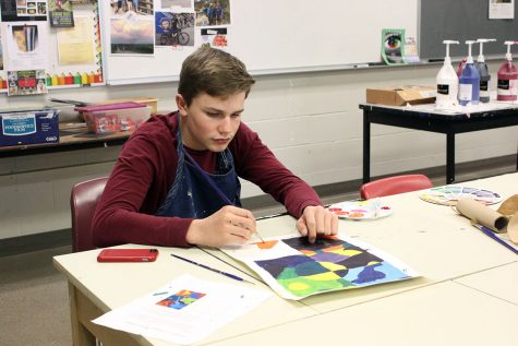 Jakeb Wilks, 9, worked on his painting project for art class. Wilks has been working on this piece for the past two weeks. Photo by K. Fisher 