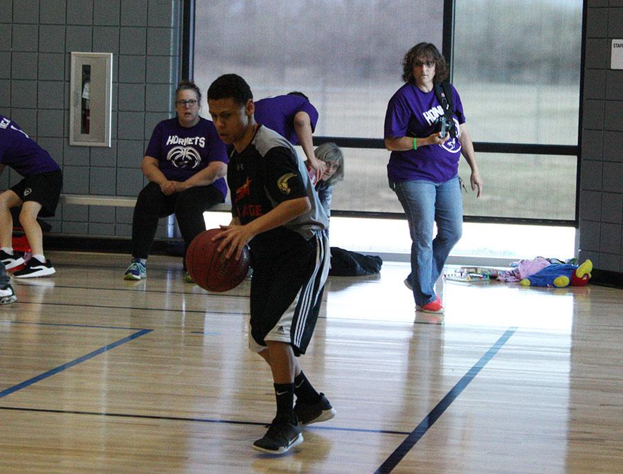 Elijah Oliver, 10, dribbles the basketball. Tri-county held an award ceremony for each of their athletes. Photo by L. Severe
