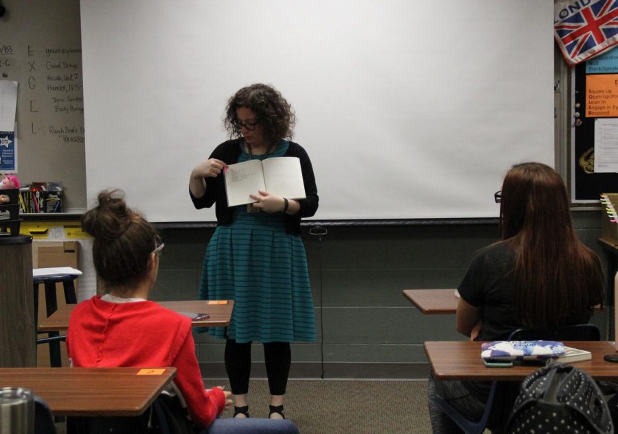 Shelly Walston shows the Productive Members of Society Club her journal. This was the first meeting for the new addition.