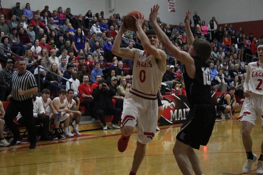 Caleb Grill drives to the basket in the second half. He scored 19 points to lead the Eagles. 