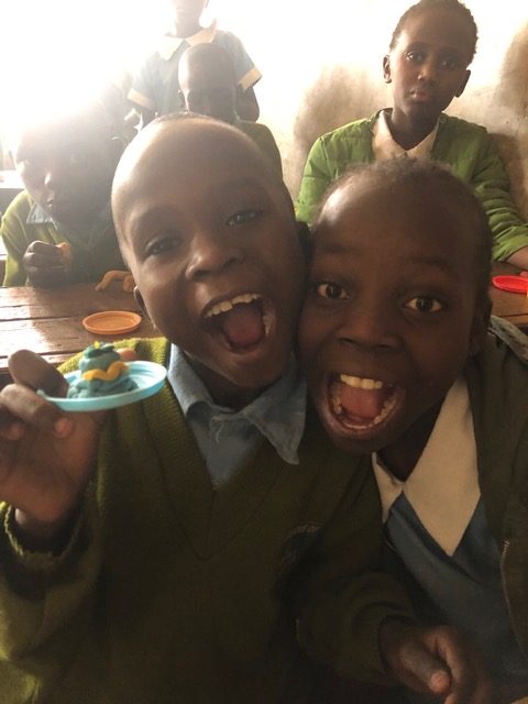 Kenyan children pose for camera.