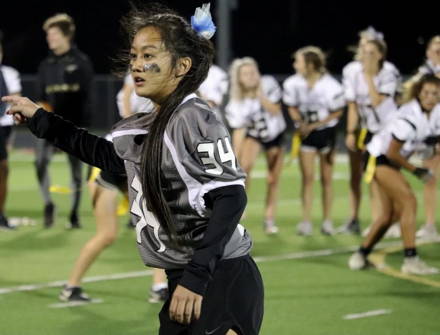 Senior Madison Em lines up at the cornerback position during the Powderpuff game on Wednesday, October 11. The seniors would prove victorious winning 24-18.