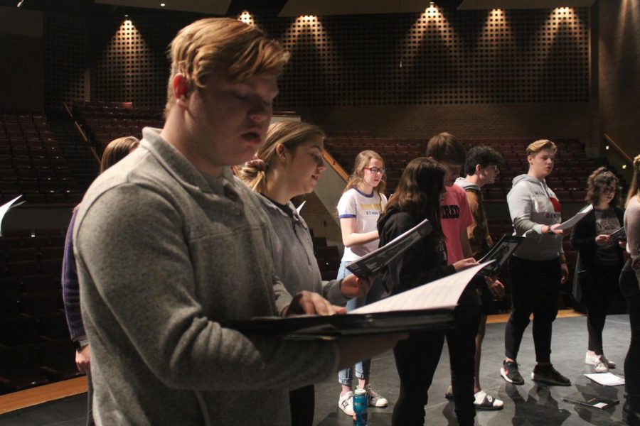 Junior Gavin Wright rehearses The World for Christmas with the madrigals ensemble. The concert is Dec. 6 and 7 at 7:30 p.m.