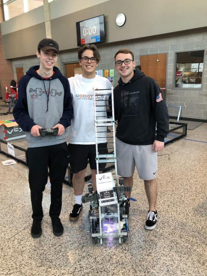 Jacob Shove, Sam Bartlett, and Cole Sphar with their winning robot.