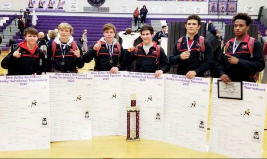 The wrestling team with their first place bracket.