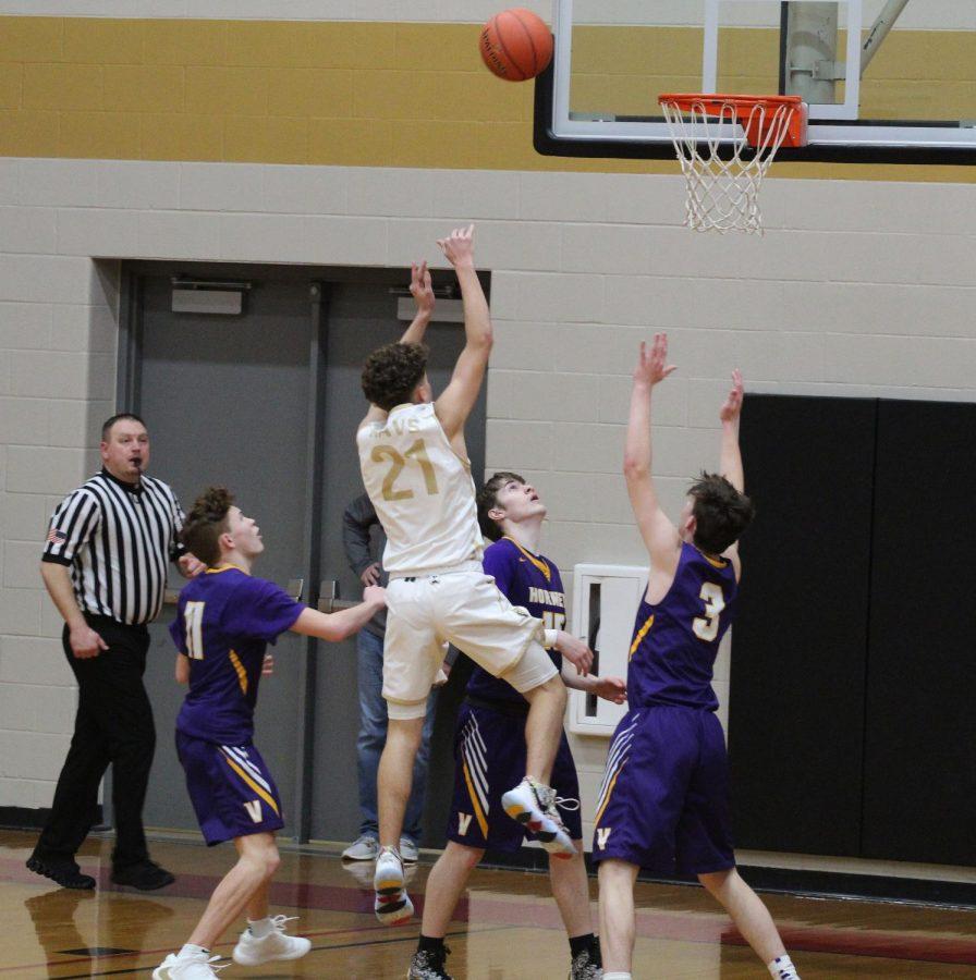 Elevating above the defenders, freshman Tatum Steinhoff flies through the lane towards the basket. 