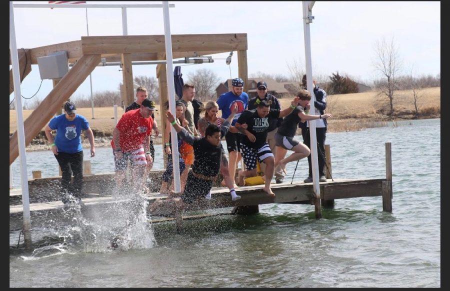 Leaping+in+union%2C+a+dozen+Plunge+participants+jump+into+the+freezing+lake+to+raise+money+for+the+2020+Special+Olympics+games%2C+held+at+Maize+South+in+July+2020.