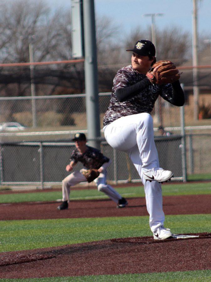Junior Beau Grant pitches the ball during the baseball scrimmage on Thursday, March 12. The Mavericks kick off their season on Saturday, March 28 in Lawrence, KS.